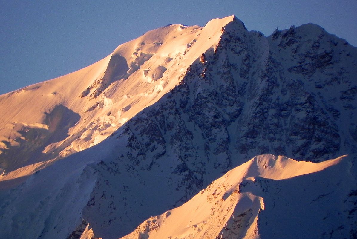 10 Shishapangma Main, Central And West Summits Close Up At Sunrise From Shishapangma North Base Camp I had a perfect view of Shishapangma Main Summit to the left, Central Summit in the middle and the West Summit in shade above the north face on the right from Shishapangma North Base Camp (5029m). Jerzy Kukuczka and Artur Hajzer were the first to climb the northwest ridge on the right to the west summit (7966m) on September 18, 1987, continuing on to the Main Summit. Kukuczka thus became the second climber (after Reinhold Messner) to climb all 14 8000m peaks.